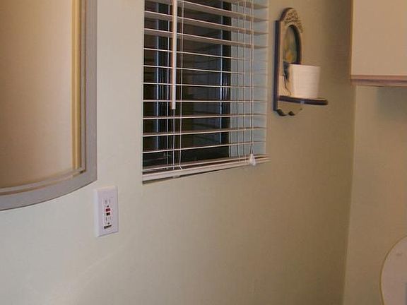 Bathroom with electric toilet