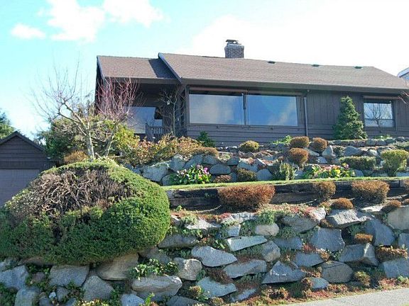 Terraced front yard; detached garage...