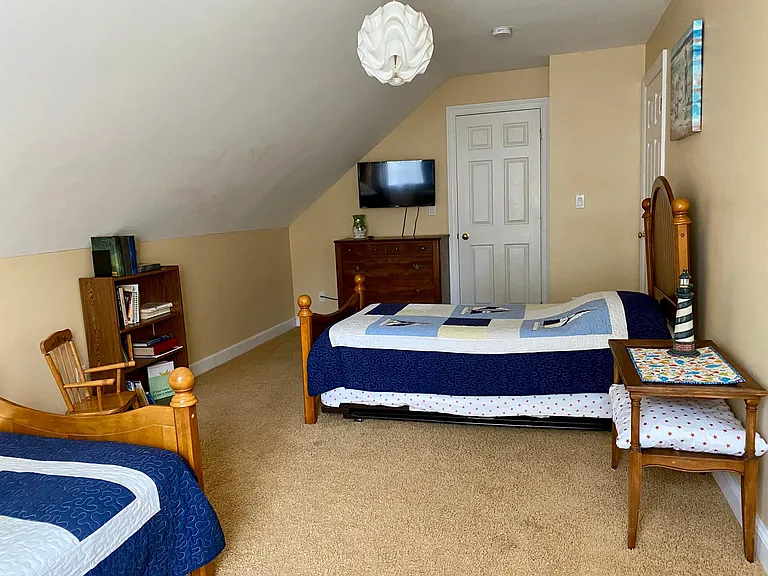 This bedroom also includes a Smart TV