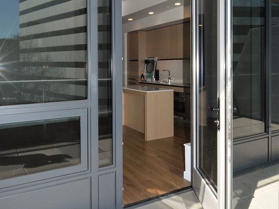 Interior Door Access from Living Room of Unit #700 to the Exterior Private Deck Area