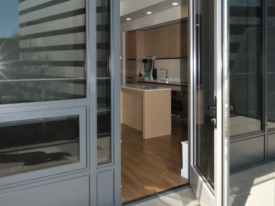 Interior Door Access from Living Room of Unit #700 to the Exterior Private Deck Area