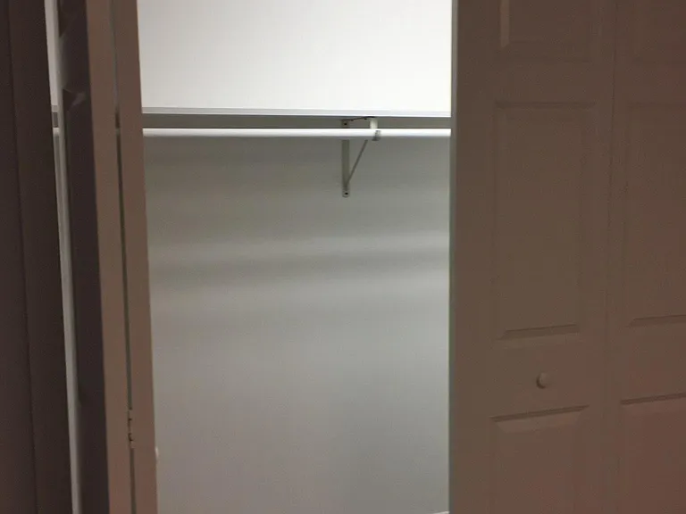 large walk in closet in bedroom