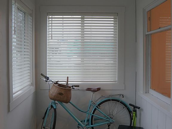 enclosed porch - perfect for bikes and shoes!