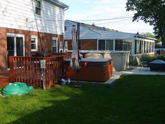 Back View.  Deck, Hot-Tub, Concrete Patio, Pool.