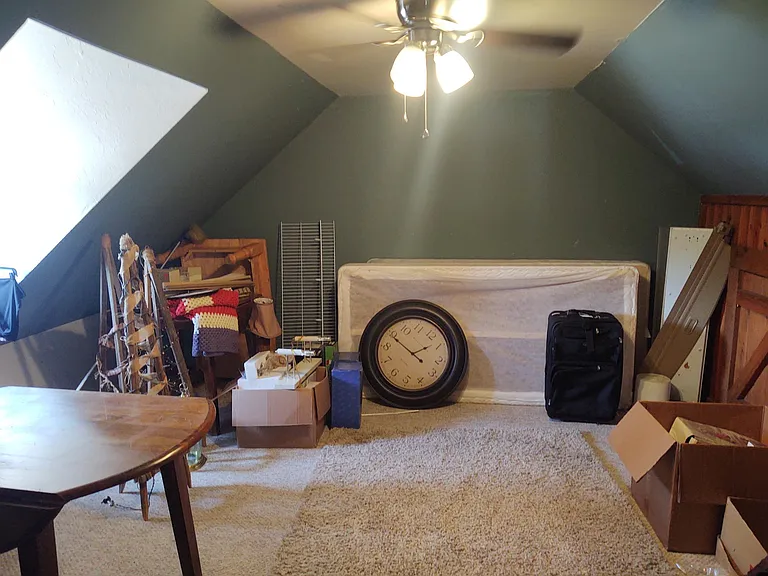 Up stairs bedroom little messy using as storage