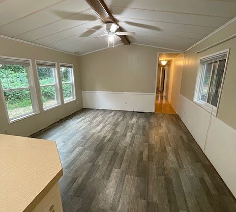 Living room open to the kitchen.