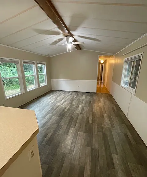 Living room open to the kitchen.