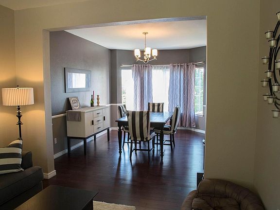 Dining and formal living space  with more of those gorgeous hardwood floors!