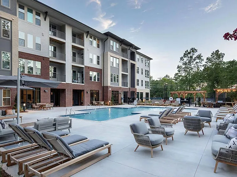 Luxury Pool Deck with Shaded Loungers and Entertaining Spaces