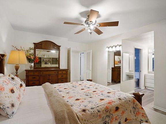 Master bedroom with walk in closet and full bathroom