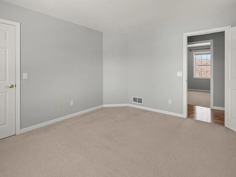 Bedroom with closet overlooking the Winooski River.