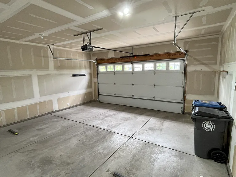 extra wide 2 car garage with 8' high door.