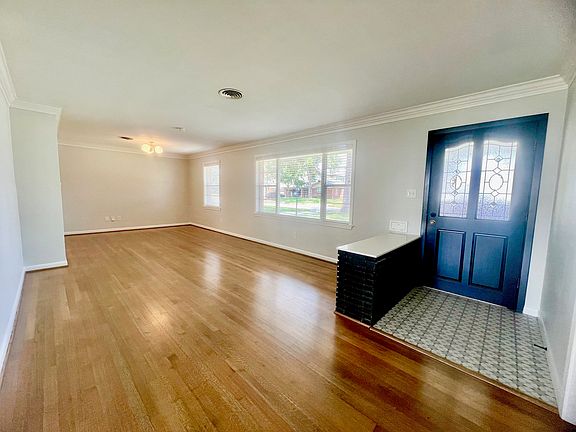Shown is the entrance and formal dining and living room. One of the rooms can also be used as an office.