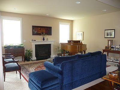 Spacious living room with natural gas fireplace.