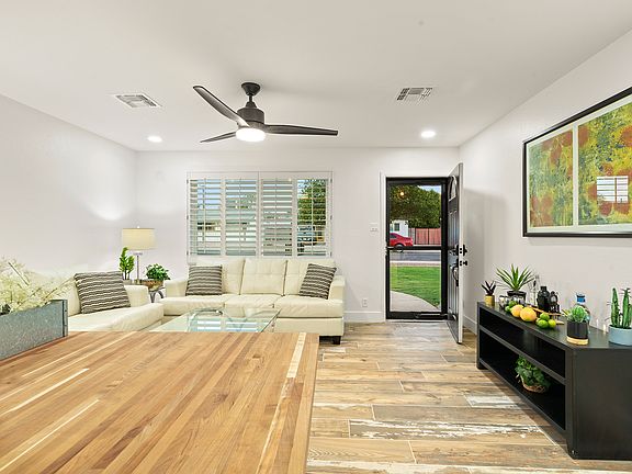 Butcher block counter top in kitchen with easy access to living room for entertaining