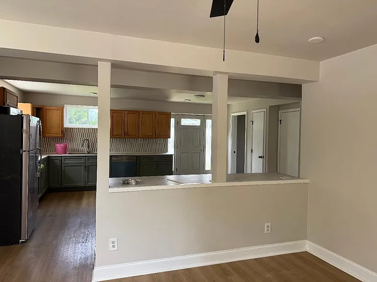 View from side entrance into living room and kitchen