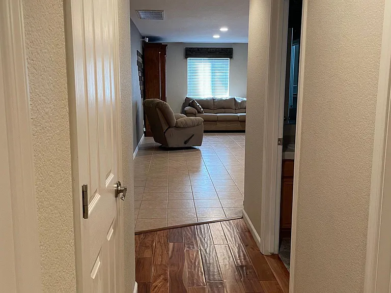 from laundry room - bedroom and bath on the right, linen closet on the left