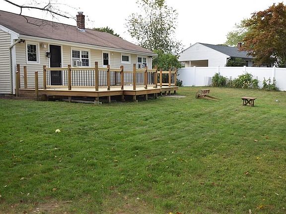 Newer white vinyl fenced in back yard