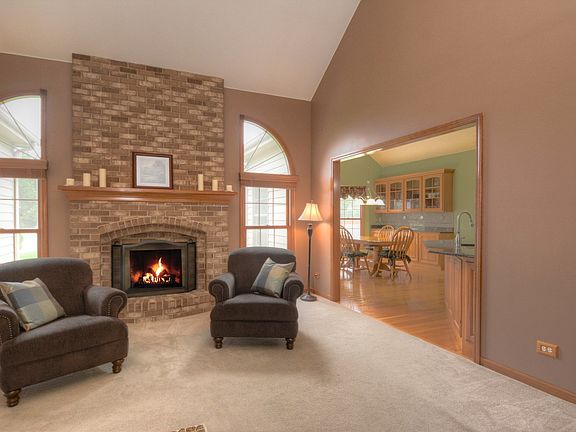 Gorgeous with Vaulted Ceiling, spacious and floor to ceiling Brick Fireplace, open to Eating area