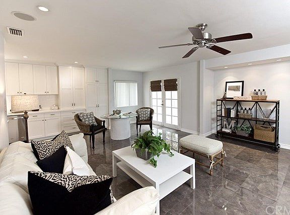 Open concept Den/kitchen with French doors to back yard.