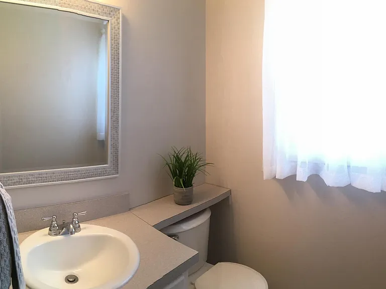 Powder room off of kitchen.