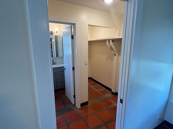 access to double master closet and ensuite master bath - view of right side of master closet
