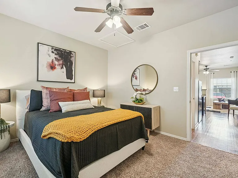 Bright and airy bedroom featuring ample closet space at Arroyo Seco Villas