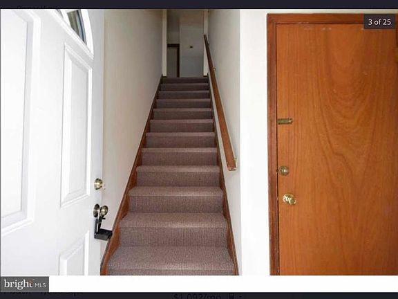 Foyer entry with living space upstairs and rec room with laundry downstairs