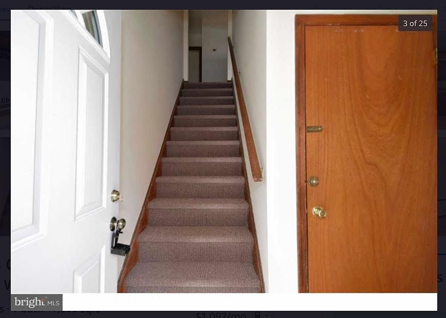 Foyer entry with living space upstairs and rec room with laundry downstairs