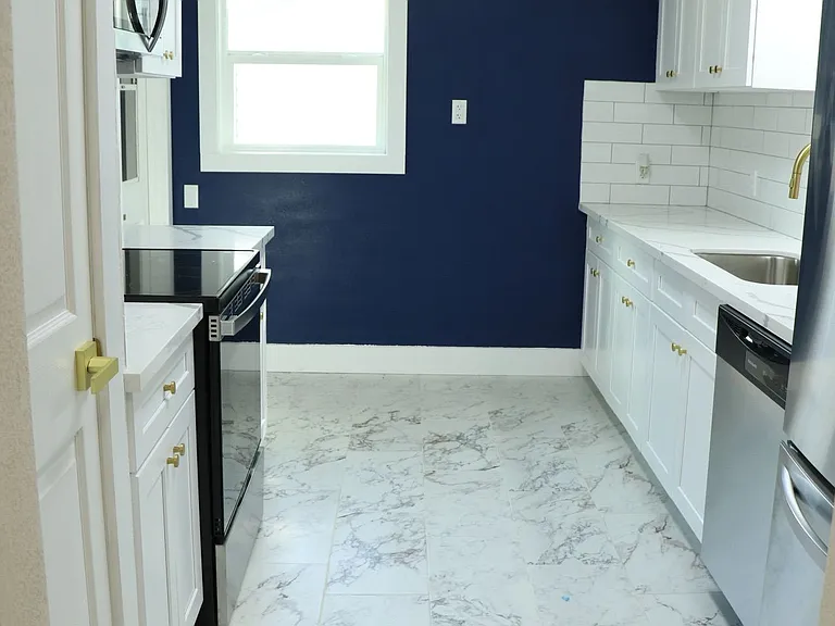Updated kitchen with modern cabinets.