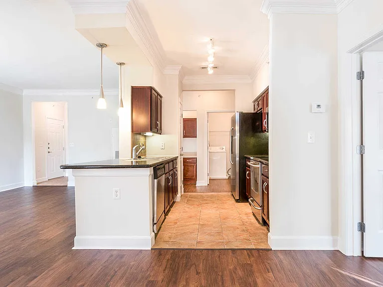 Dining Room with Hard Surface Flooring and Kitchen with Stainless Steel Appliances