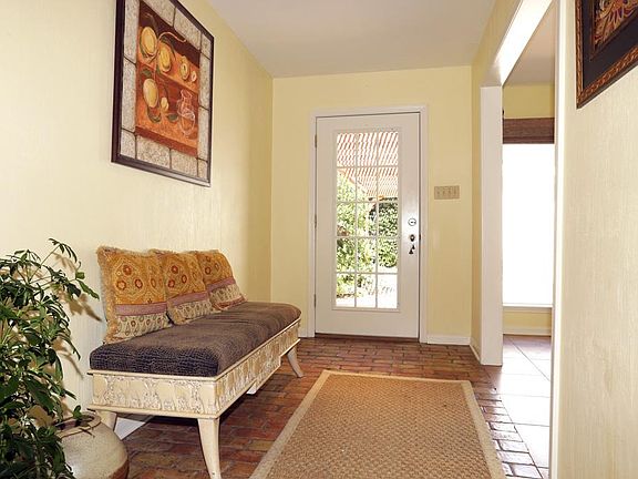 Entry hall with French door. Dining room is to the right.