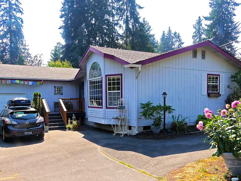 Front of house - See circular driveway in front of the house with plenty of parking for multiple cars