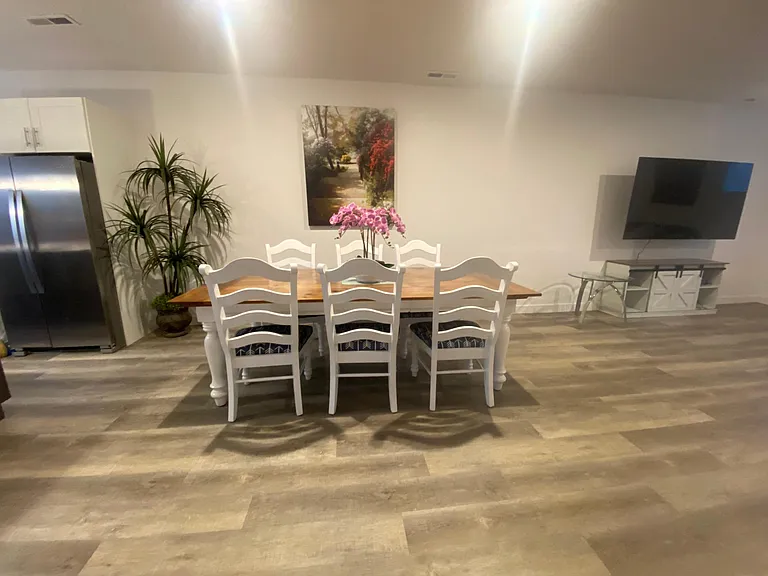 Dining area with large dining set displaced