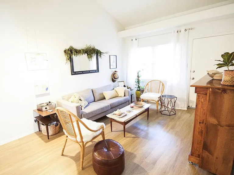 Here is another angle of the from living area. The door you see is the front door. Now the inside of the front door is painted blue.