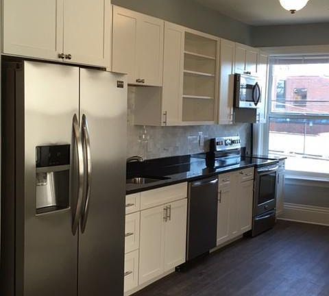 Kitchen looking towards back door/parking