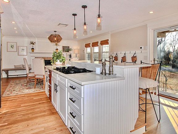 Beautiful, newly renovated, open-concept kitchen with commercial size refrigerator / freezer and 4 person breakfast bar. Kitchen is fully stocked with pots, pans, utensils, dishes, glassware, dishwasher, disposal, electric double oven, gas cook-top, coffe