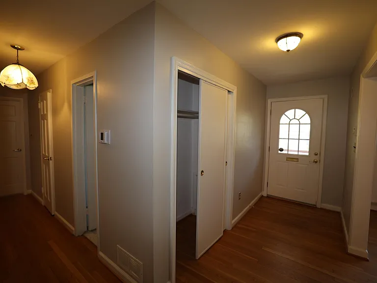 Entryway and hallway to bedrooms