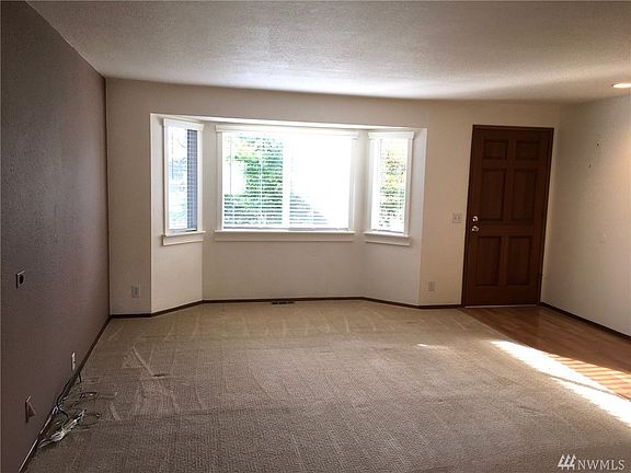 Sunny Formal Living Room faces south, and is wired for surround sound.