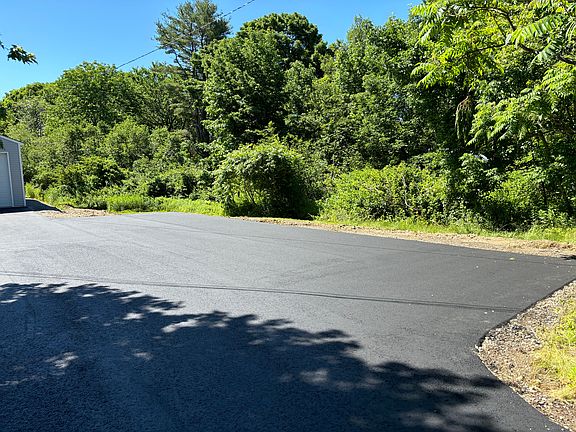 Paved driveway with parking for 6 vehicles