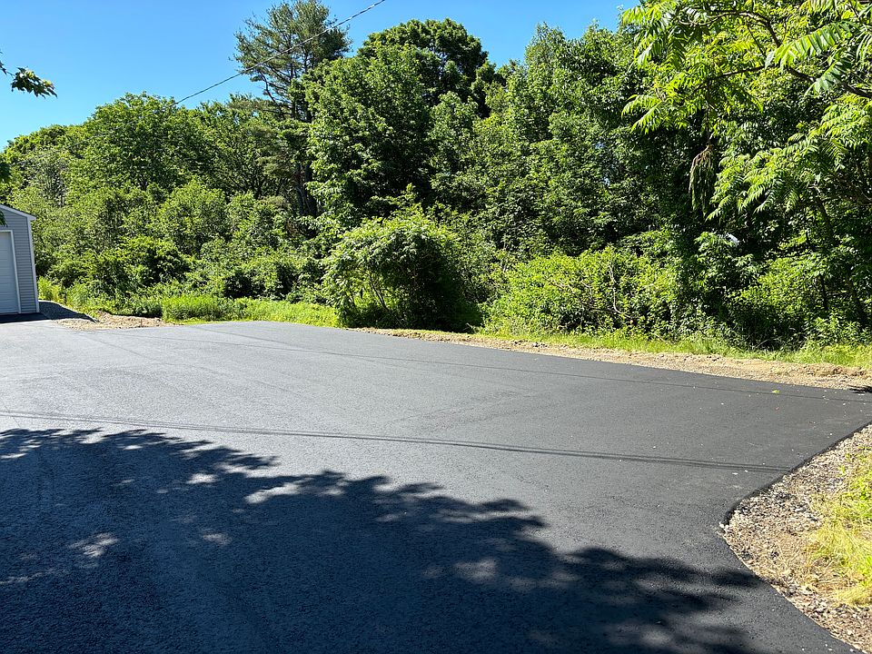 Paved driveway with parking for 6 vehicles