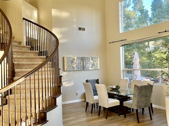 Formal dining room and spiral staircase.