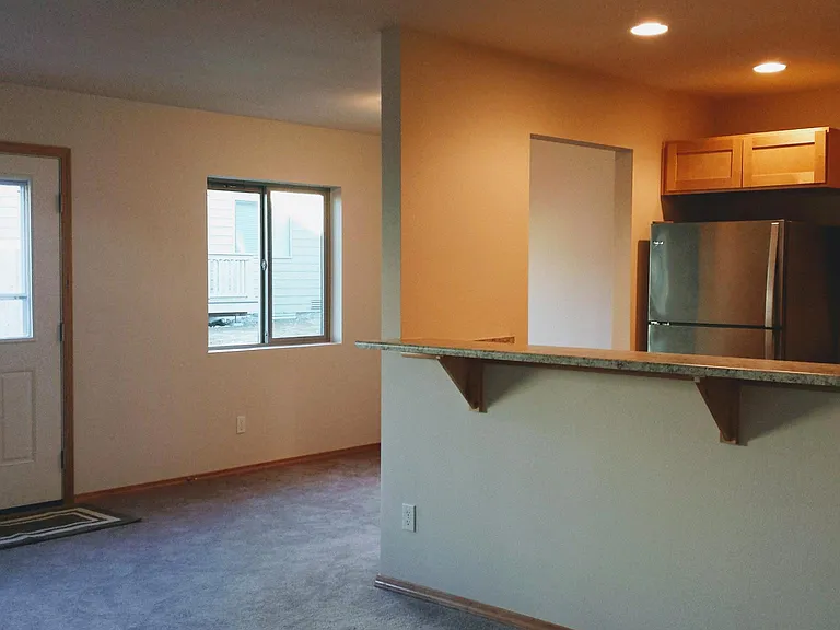 Dining room, eating bar, open up to kitchen and living room.