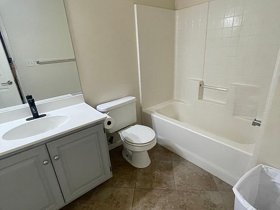 Second Bath with solid marble counter top, new fixtures and tile.