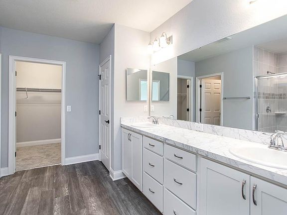 And, your suite is complete with a roomy en-suite bath - New home for sale in Lakeland, FL. Photo s