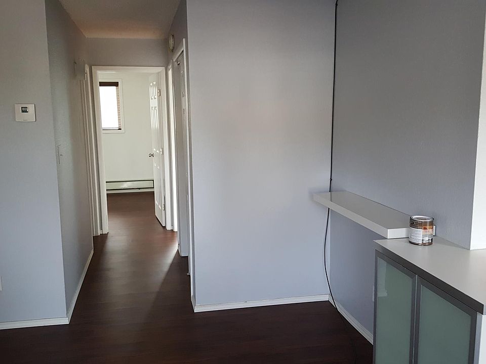 From the living area looking down the hall: large hall closet, bathroom, two large bedrooms