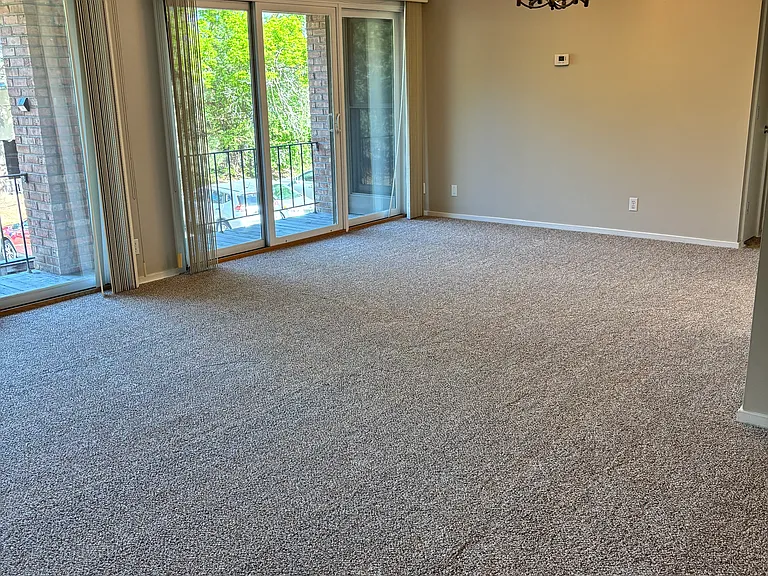 Spacious living and dining area with a wall of windows!