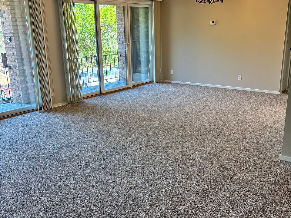 Spacious living and dining area with a wall of windows!