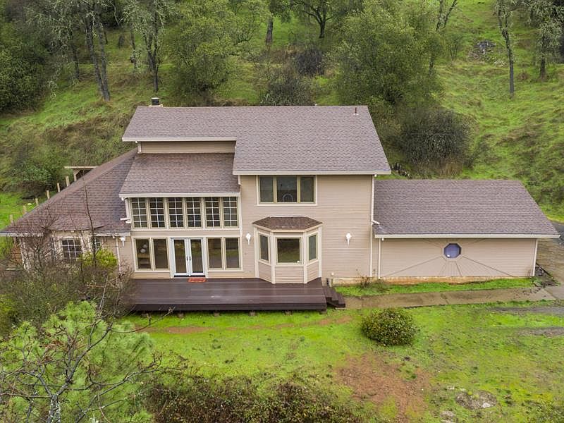 This is lovely ranch house on 5+ acres.