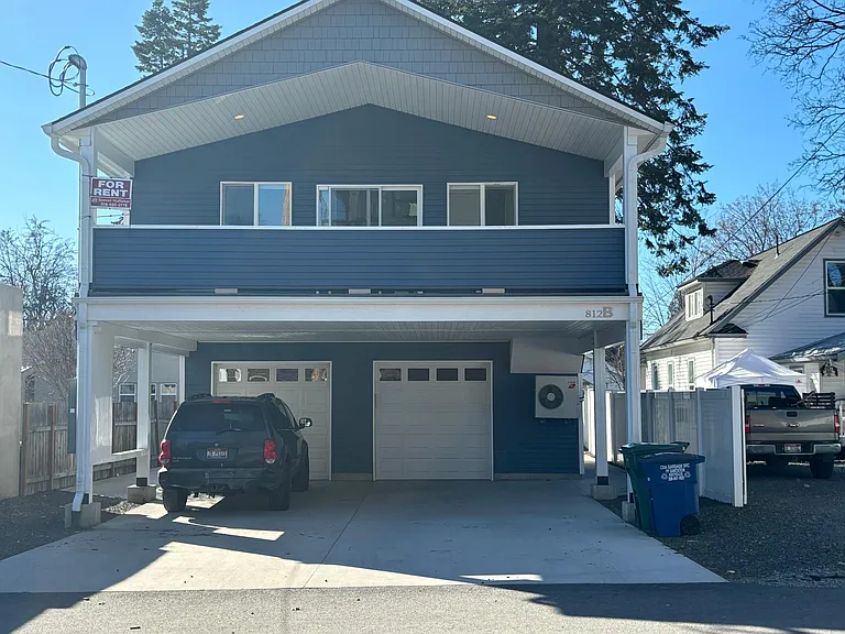 Upper unit with covered parking and secured heated 1 car garage